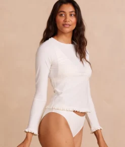 The Waterside Ruffle Rash Guard - White Sand 11 The Waterside Ruffle Rash Guard - White Sand -Summer Salt Swim Store WatersideRuffleRashGuardWhiteSandFront